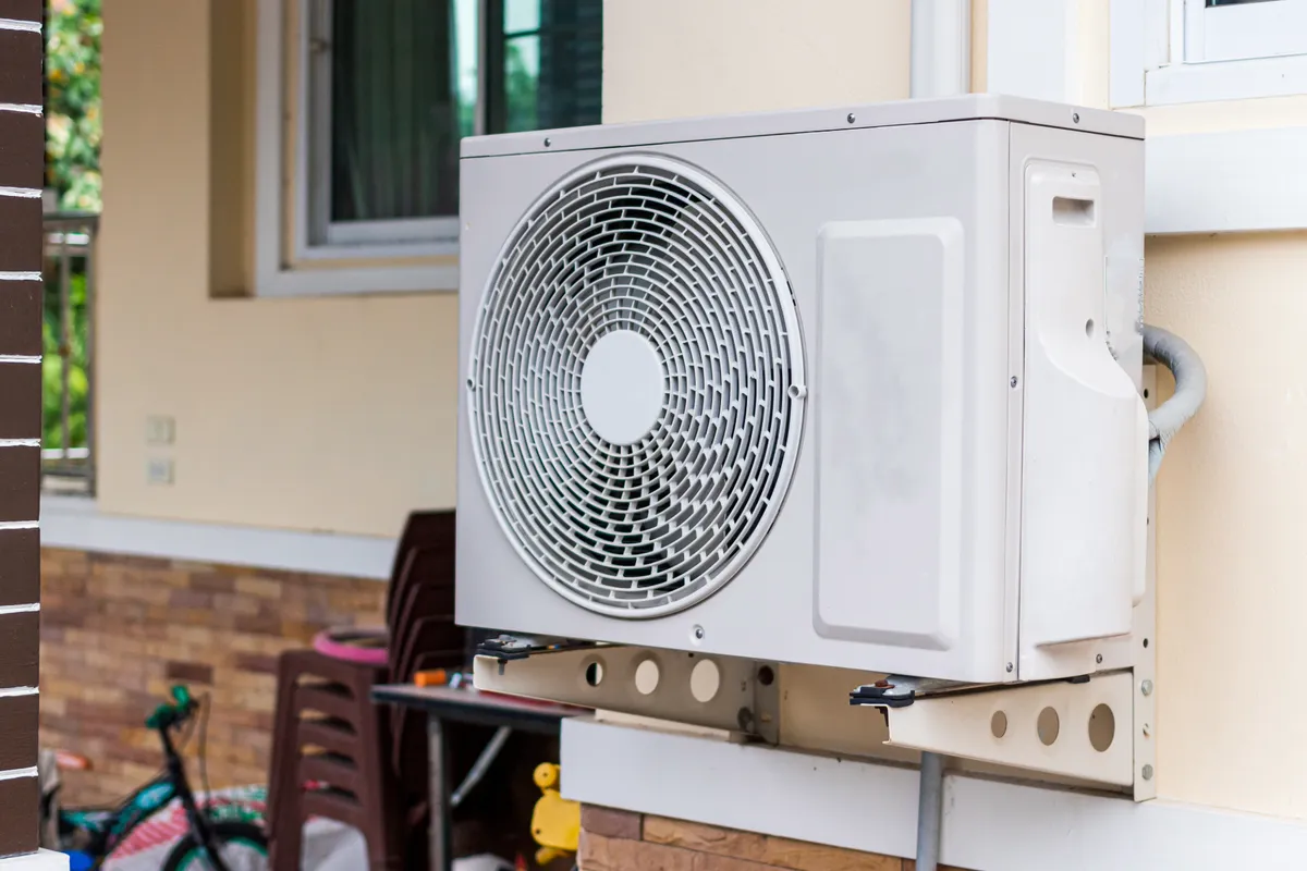 Outdoor heat pump unit on a wall bracket